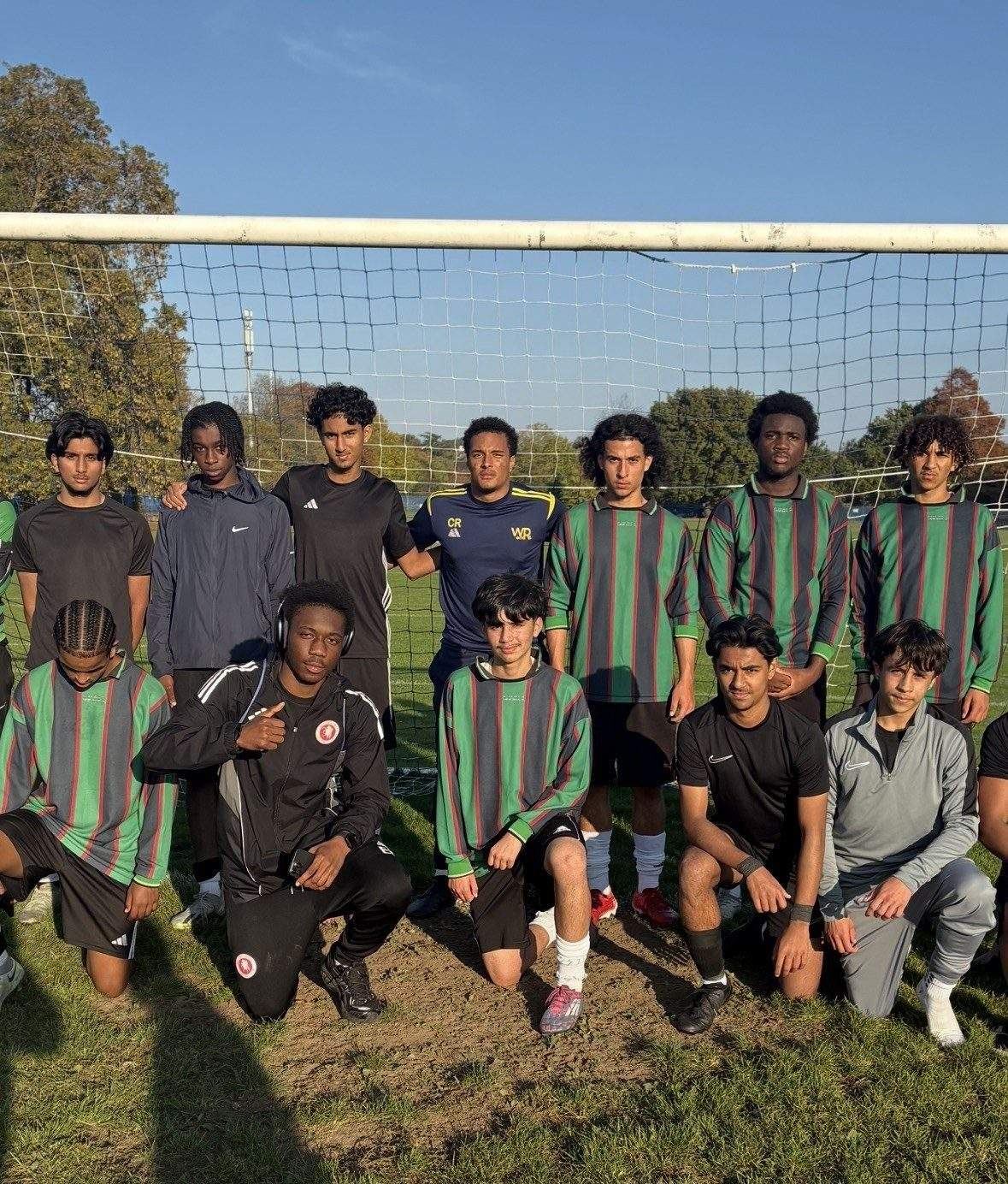 WorkRate players and coaches in green and red kits