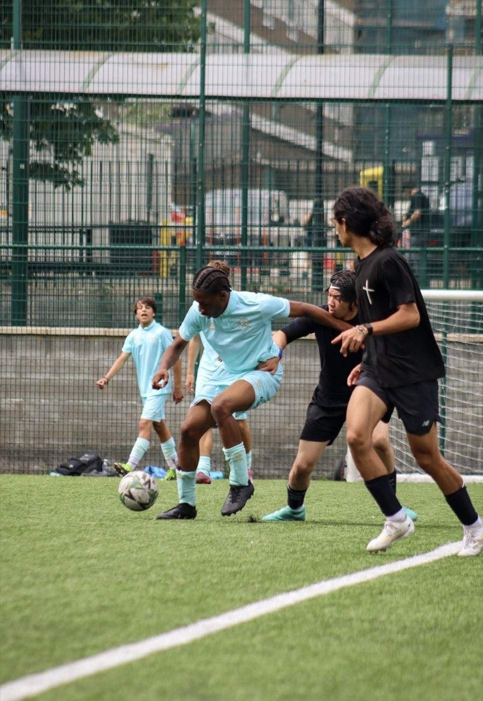 Players competing for the ball in a showcase game