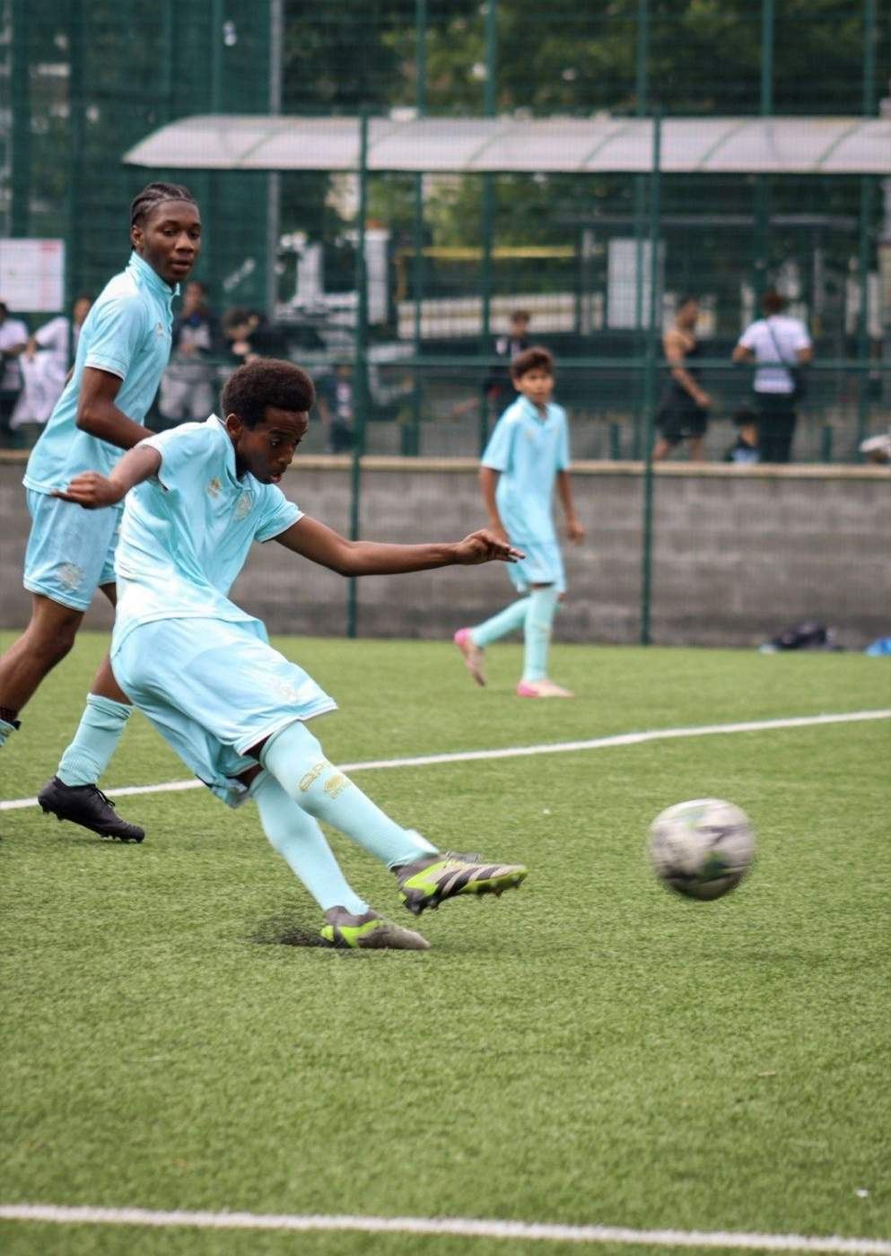Player striking the ball during a showcase game