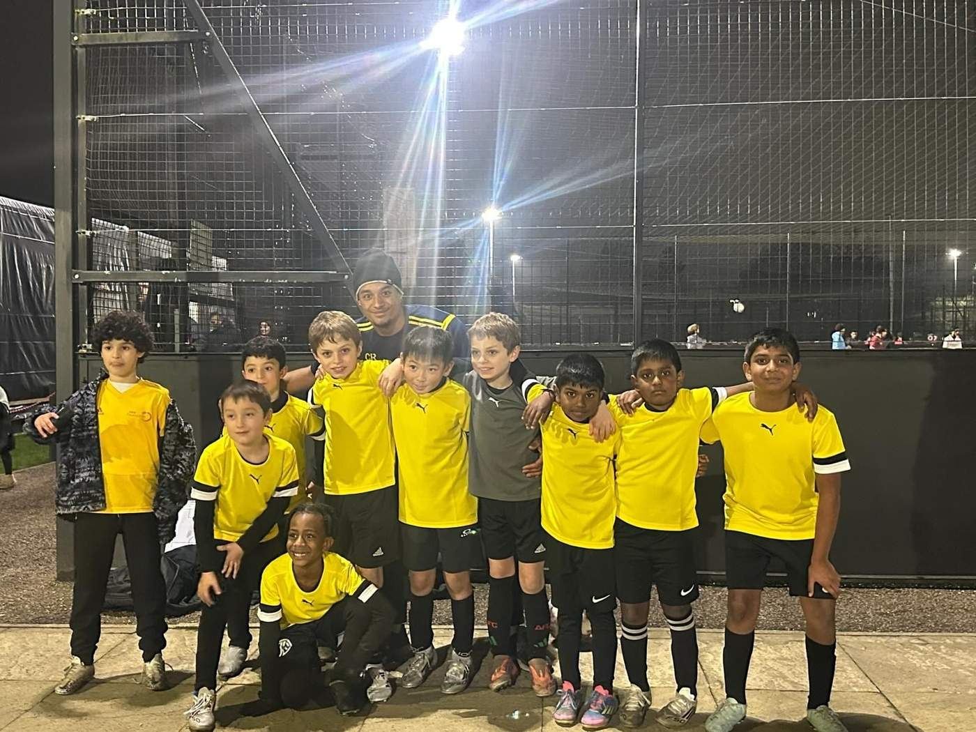 WorkRate players in yellow kits with their coach