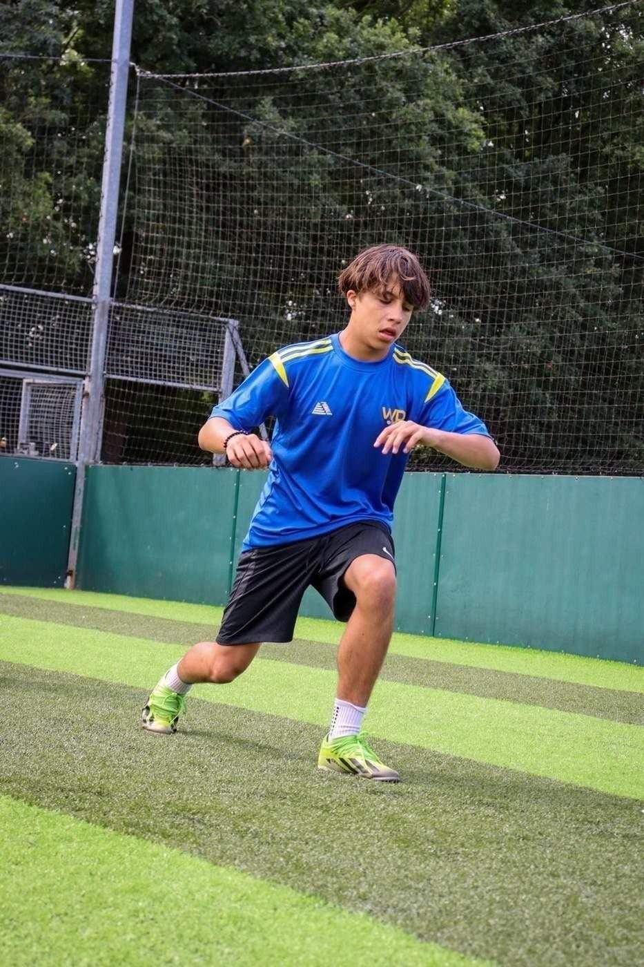 Player working on movement and technique at summer camp